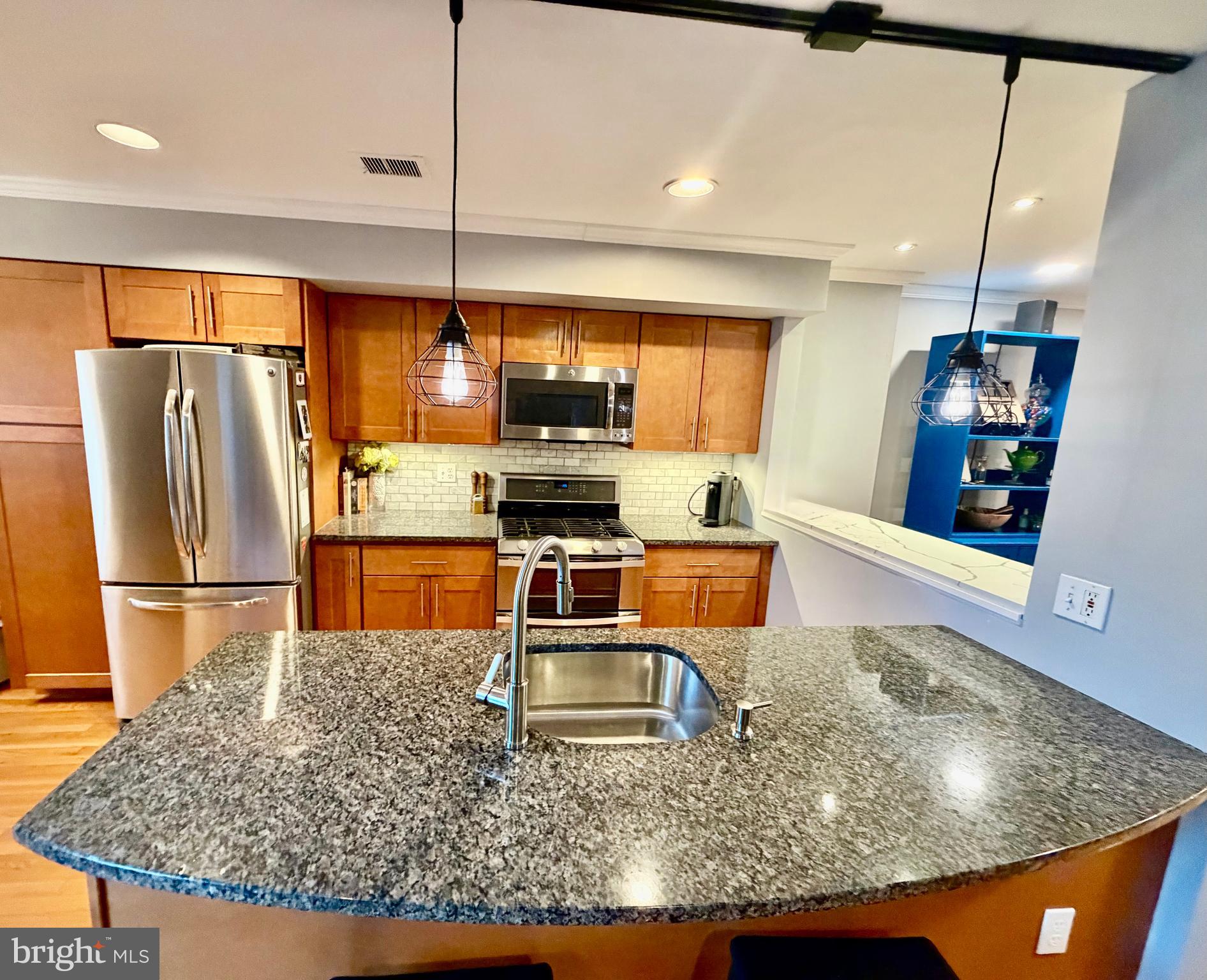 100 North 22nd Street, Unit 106 Philadelphia, PA 19103 - Photo 6 of 26 a kitchen with stainless steel appliances granite countertop a refrigerator a stove and a sink