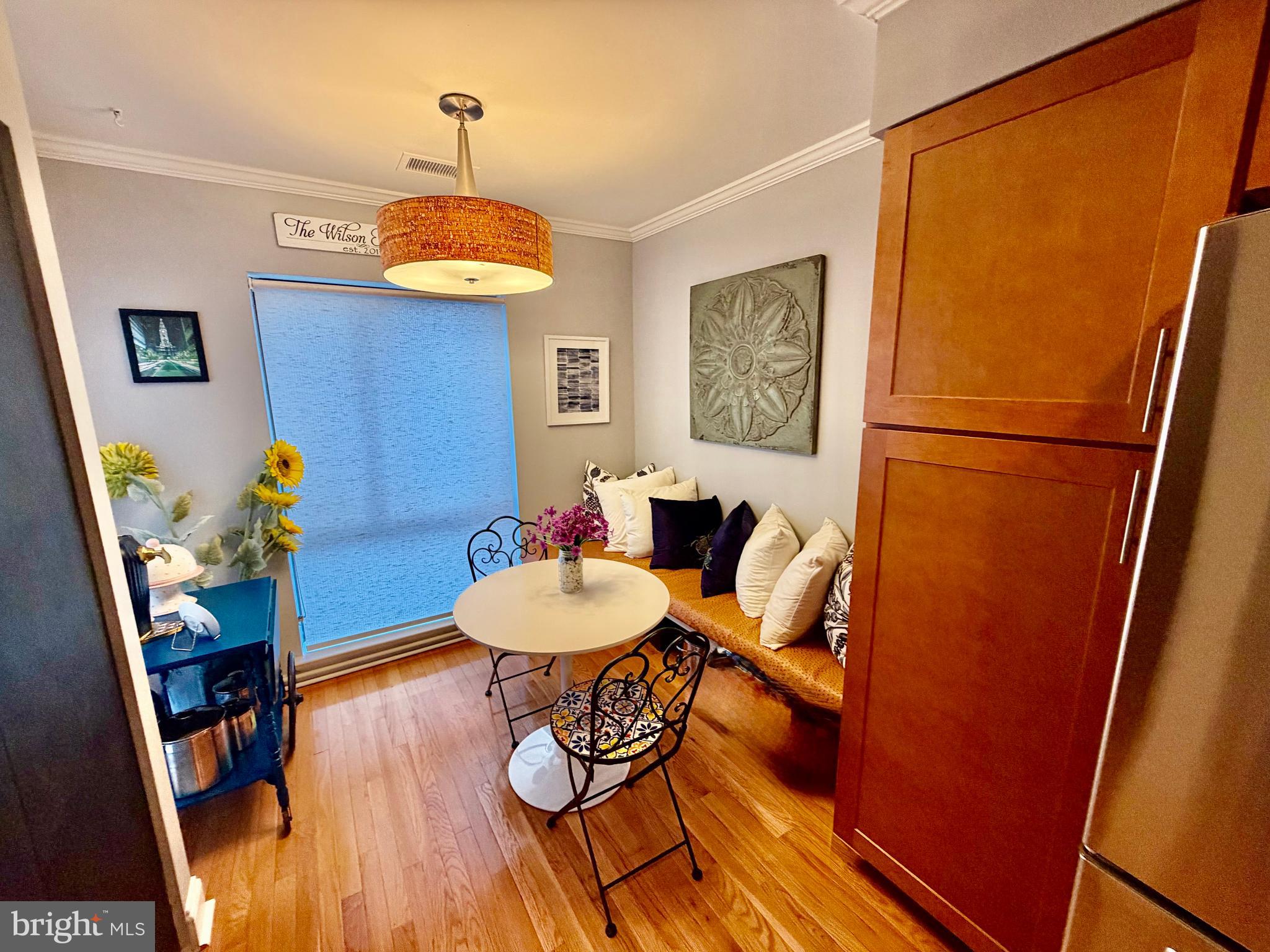 100 North 22nd Street, Unit 106 Philadelphia, PA 19103 - Photo 8 of 26 a view of a dining room with furniture and wooden floor