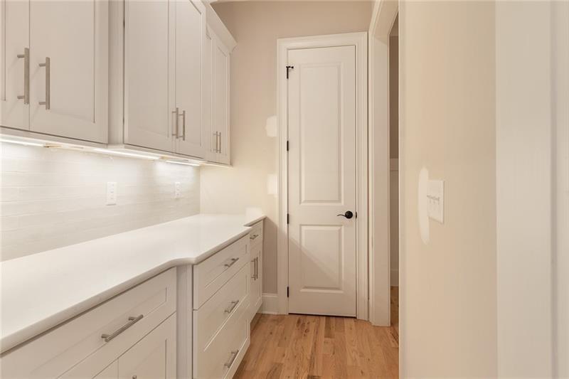 304 Trecastle Lane Canton, GA 30114 - Photo 13 of 31 a view of a kitchen with white cabinets