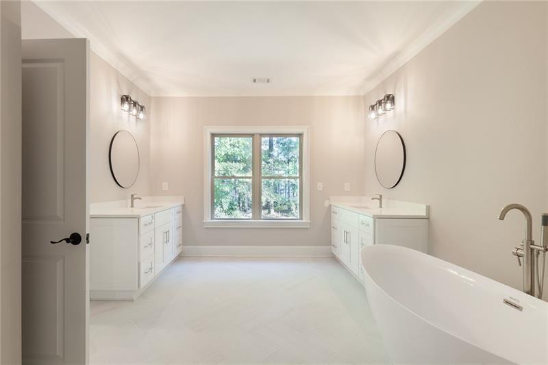304 Trecastle Lane Canton, GA 30114 - Photo 21 of 31 a bathroom with a granite countertop sink a mirror and a bathtub