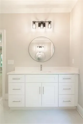 a bathroom with a mirror and a sink