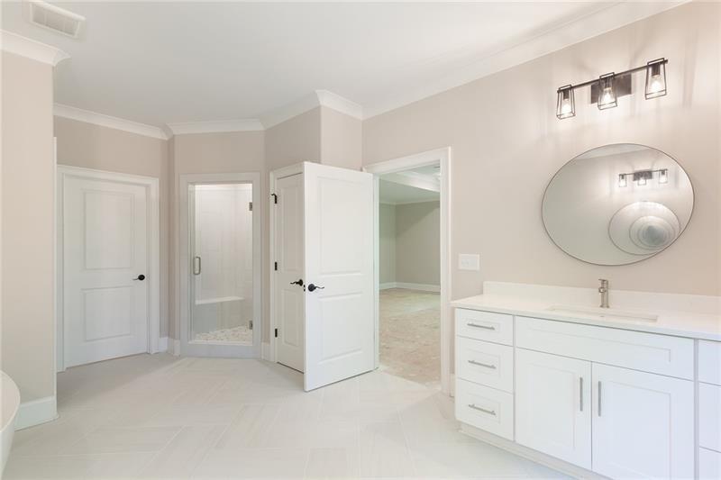 304 Trecastle Lane Canton, GA 30114 - Photo 24 of 31 a bathroom with a mirror and a sink