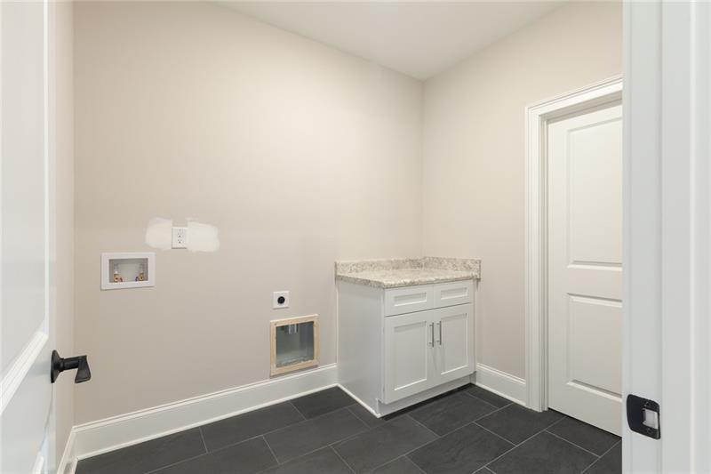 304 Trecastle Lane Canton, GA 30114 - Photo 27 of 31 a view of cabinets and window