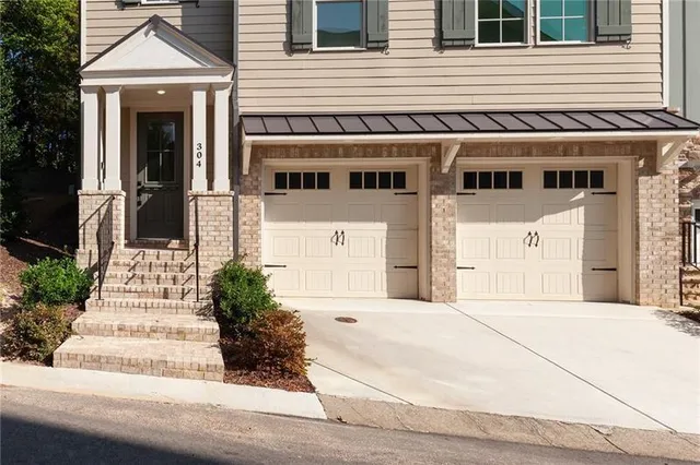 a view of a hallway with wooden floor and entryway