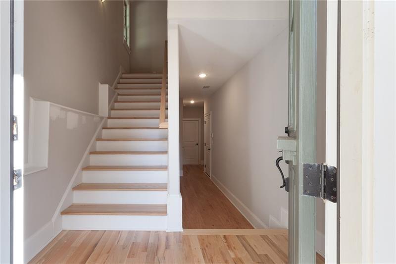 304 Trecastle Lane Canton, GA 30114 - Photo 5 of 31 a view of a hallway with wooden floor and entryway