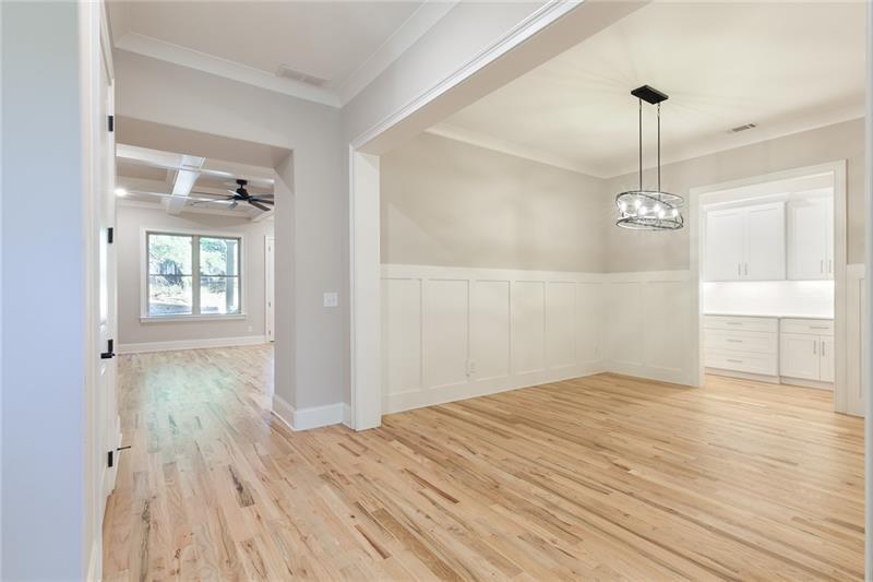 304 Trecastle Lane Canton, GA 30114 - Photo 6 of 31 a view of empty room with wooden floor and fan
