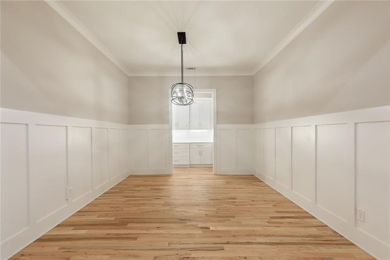 304 Trecastle Lane Canton, GA 30114 - Photo 7 of 31 a view of an empty room with wooden floor and a window