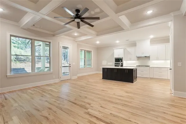 a kitchen with stainless steel appliances granite countertop a wooden cabinets and a sink