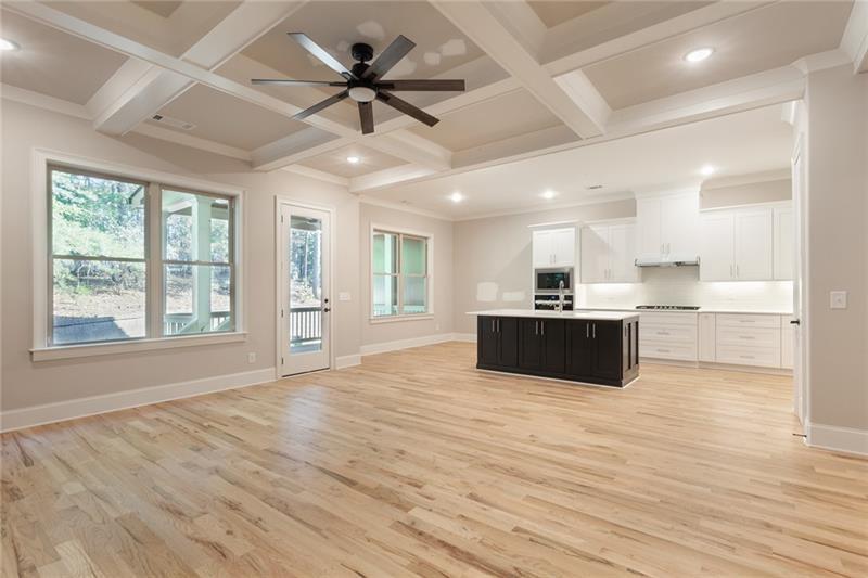 304 Trecastle Lane Canton, GA 30114 - Photo 8 of 31 a large kitchen with kitchen island a sink stainless steel appliances and a large window