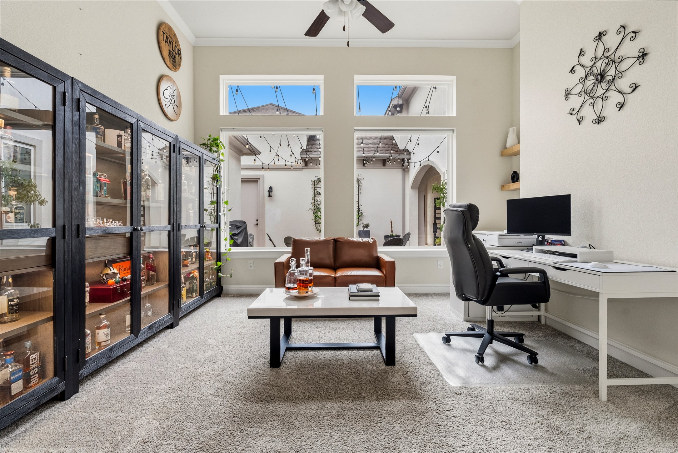 4513 Vieste View Leander, TX 78641 - Photo 23 of 40 Carpeted interior space featuring tall ceilings, a ceiling fan, and multiple windows