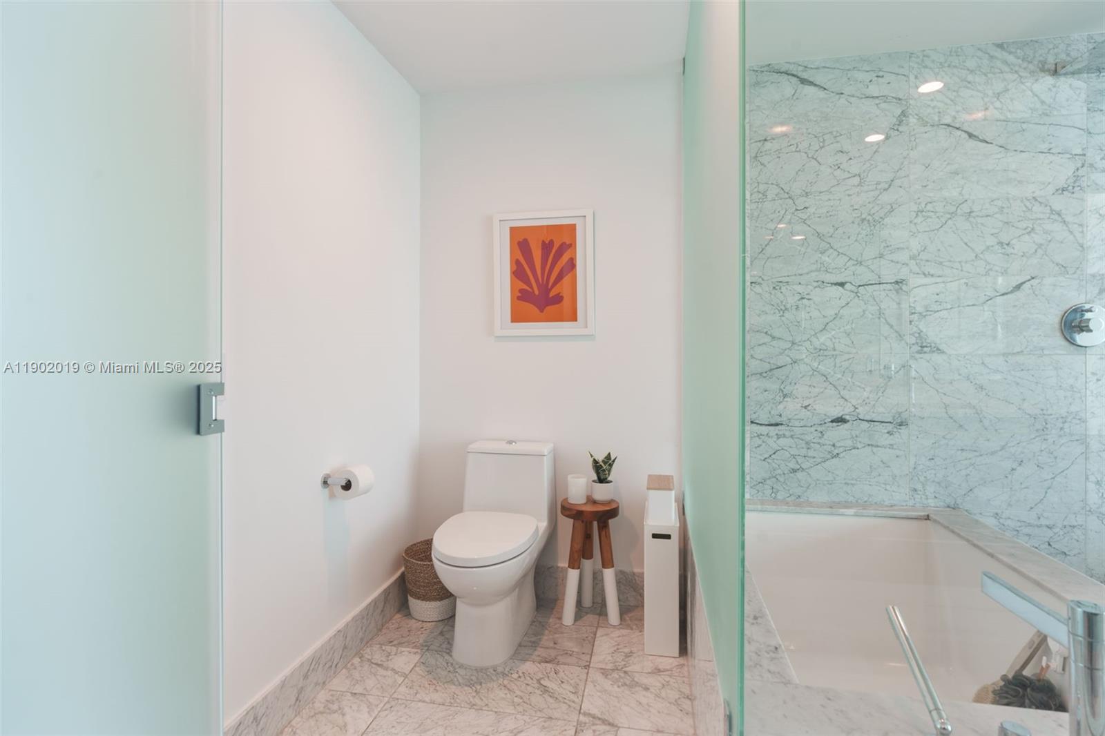 3131 Northeast 7th Avenue, Unit 2202 Miami, FL 33137 - Photo 17 of 68 a bathroom with a toilet and a shower