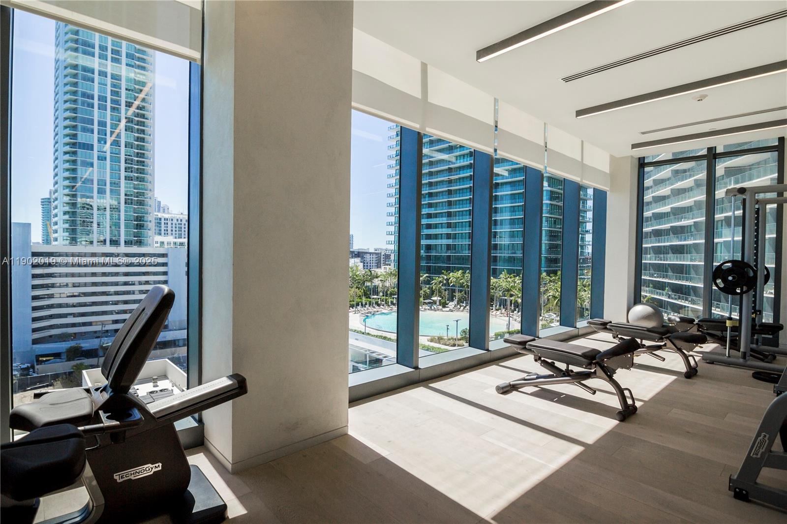 3131 Northeast 7th Avenue, Unit 2202 Miami, FL 33137 - Photo 33 of 68 a living room with furniture and large windows