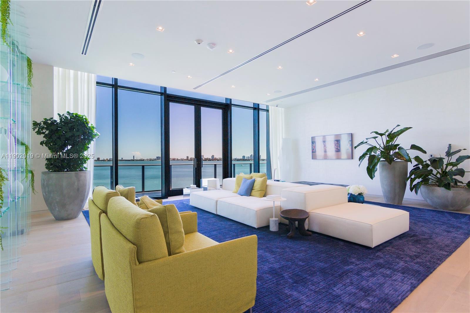 3131 Northeast 7th Avenue, Unit 2202 Miami, FL 33137 - Photo 40 of 68 a living room with furniture potted plant and a large window
