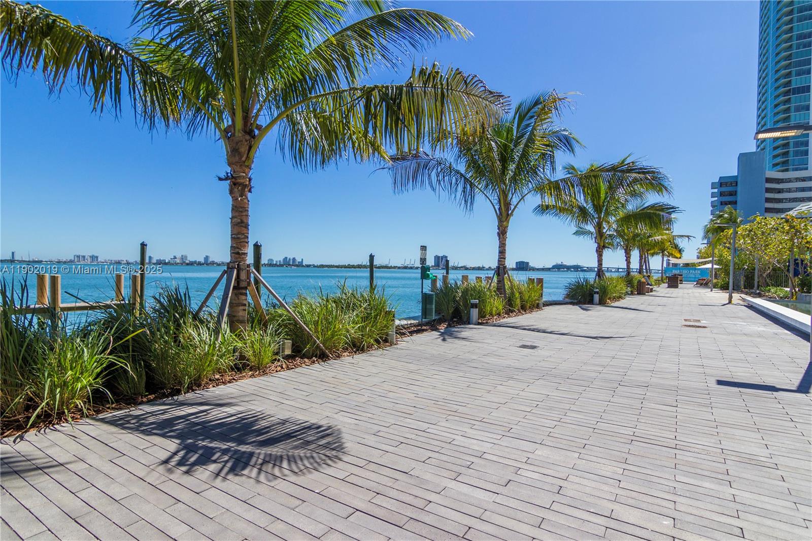 3131 Northeast 7th Avenue, Unit 2202 Miami, FL 33137 - Photo 57 of 68 a view of a backyard of a house with palm trees