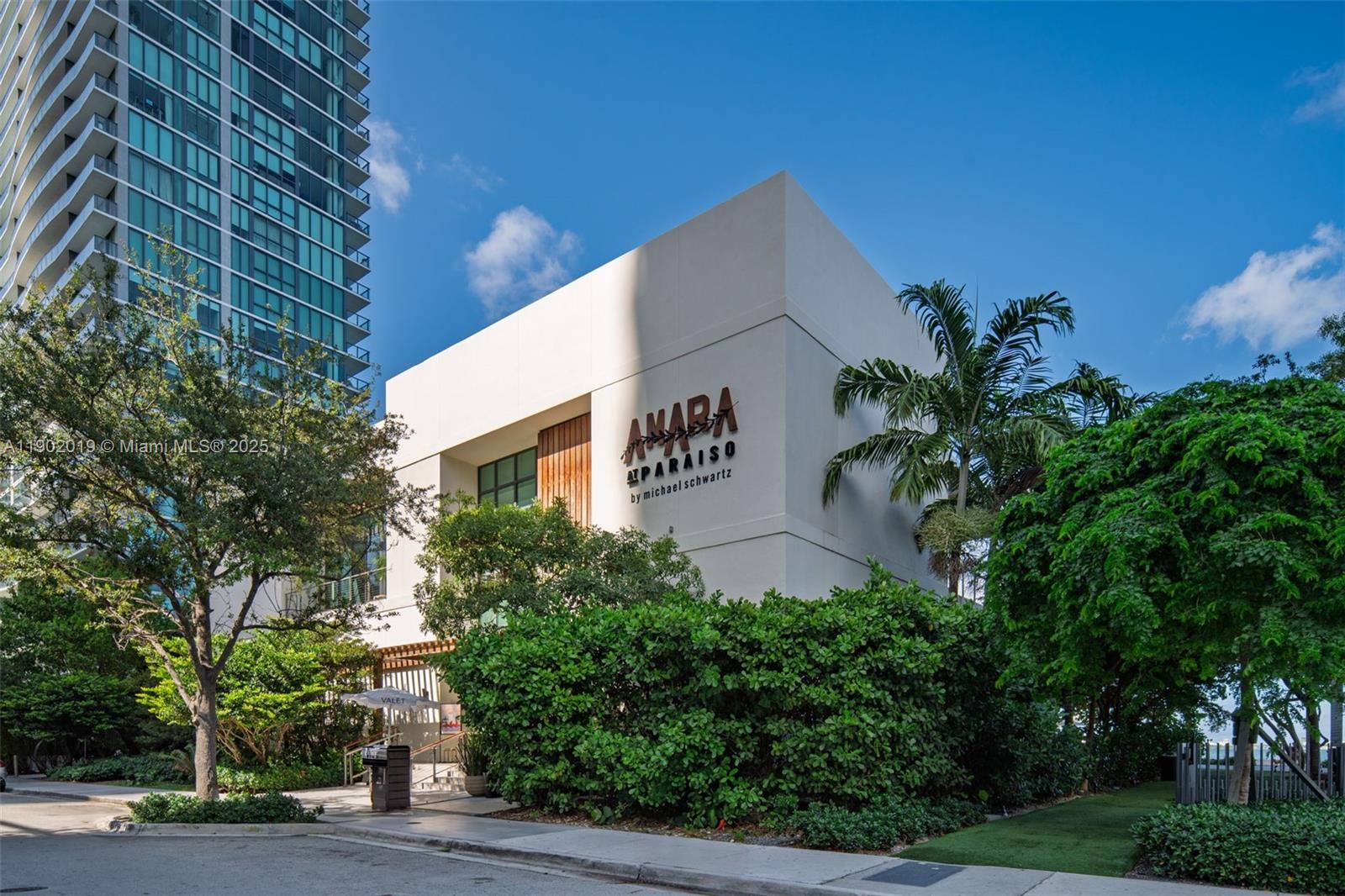 3131 Northeast 7th Avenue, Unit 2202 Miami, FL 33137 - Photo 58 of 68 a front view of a building with garden