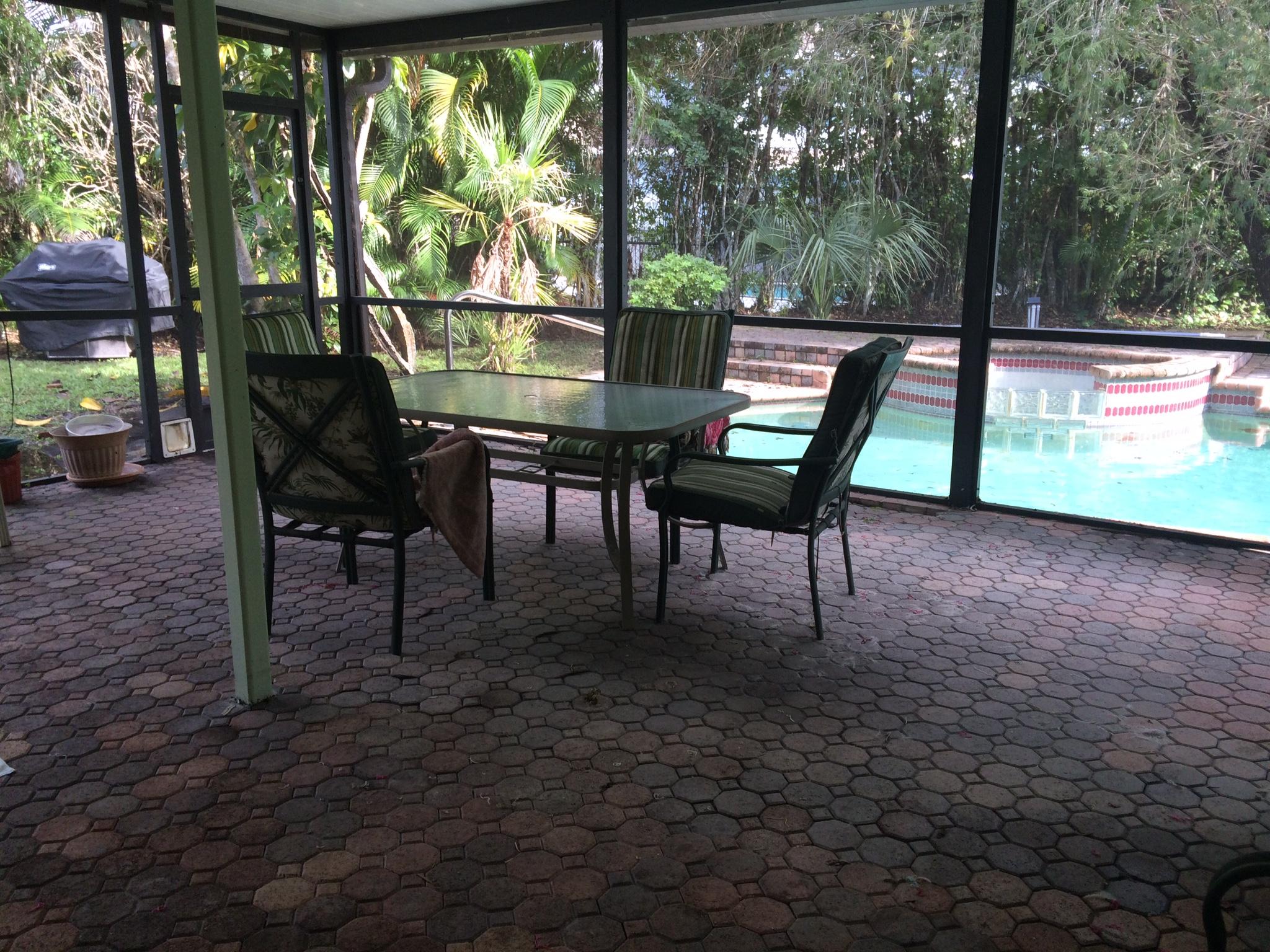 22146 Candle Court Boca Raton, FL 33428 - Photo 17 of 24 a view of a chairs and table in the patio