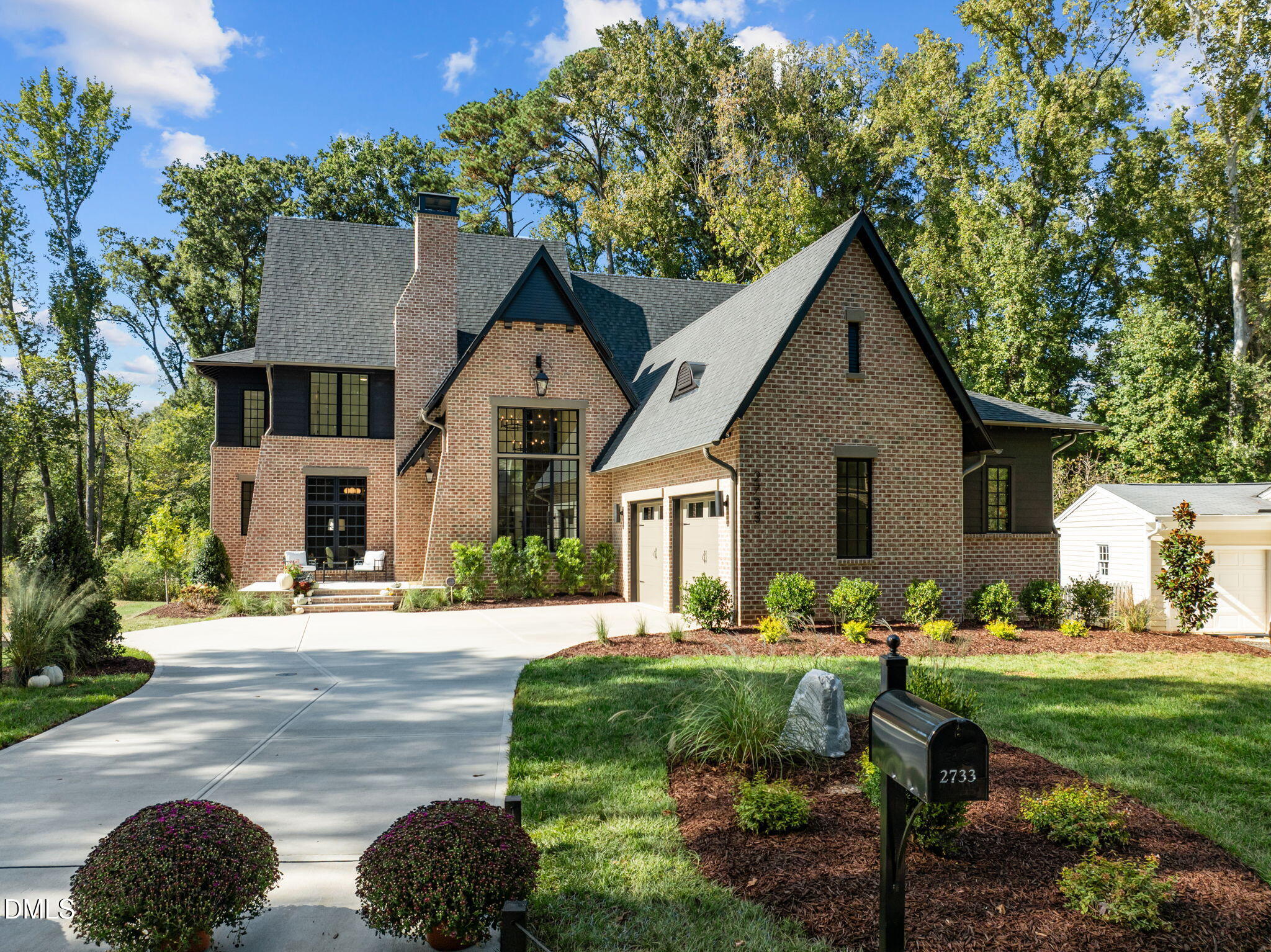 2733 Rothgeb Drive Raleigh, NC 27609 - Photo 1 of 63 a front view of a house with garden