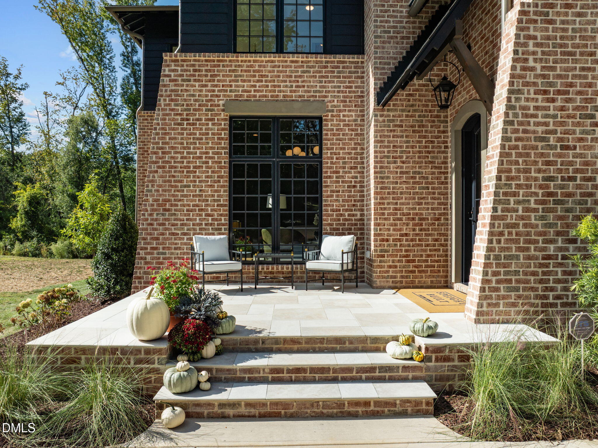 2733 Rothgeb Drive Raleigh, NC 27609 - Photo 3 of 63 a front view of a house with potted plants