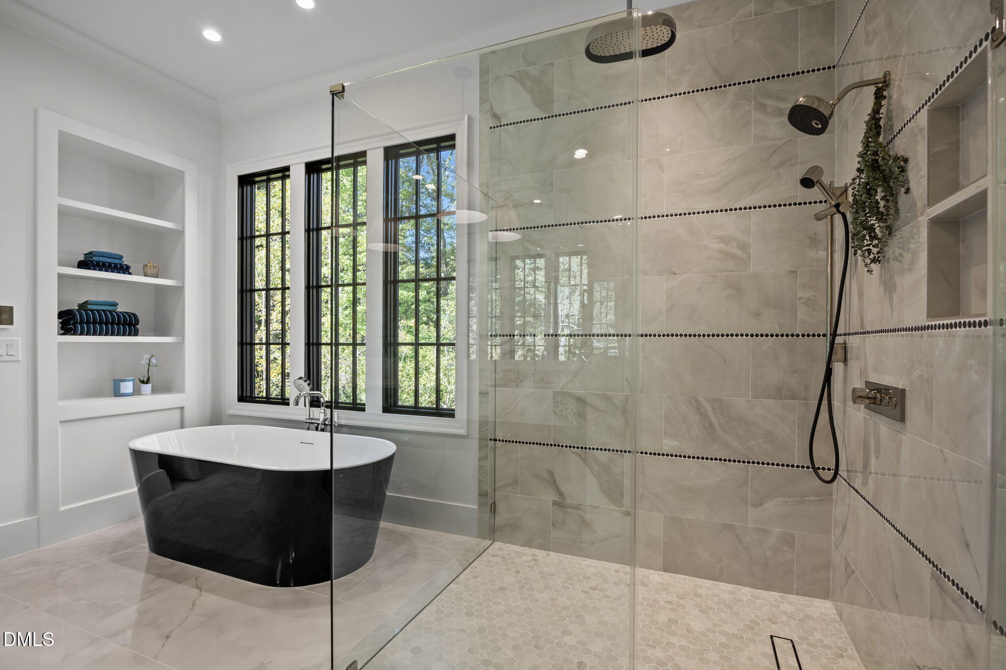 2733 Rothgeb Drive Raleigh, NC 27609 - Photo 33 of 63 a bathroom with a tub a sink and a shower
