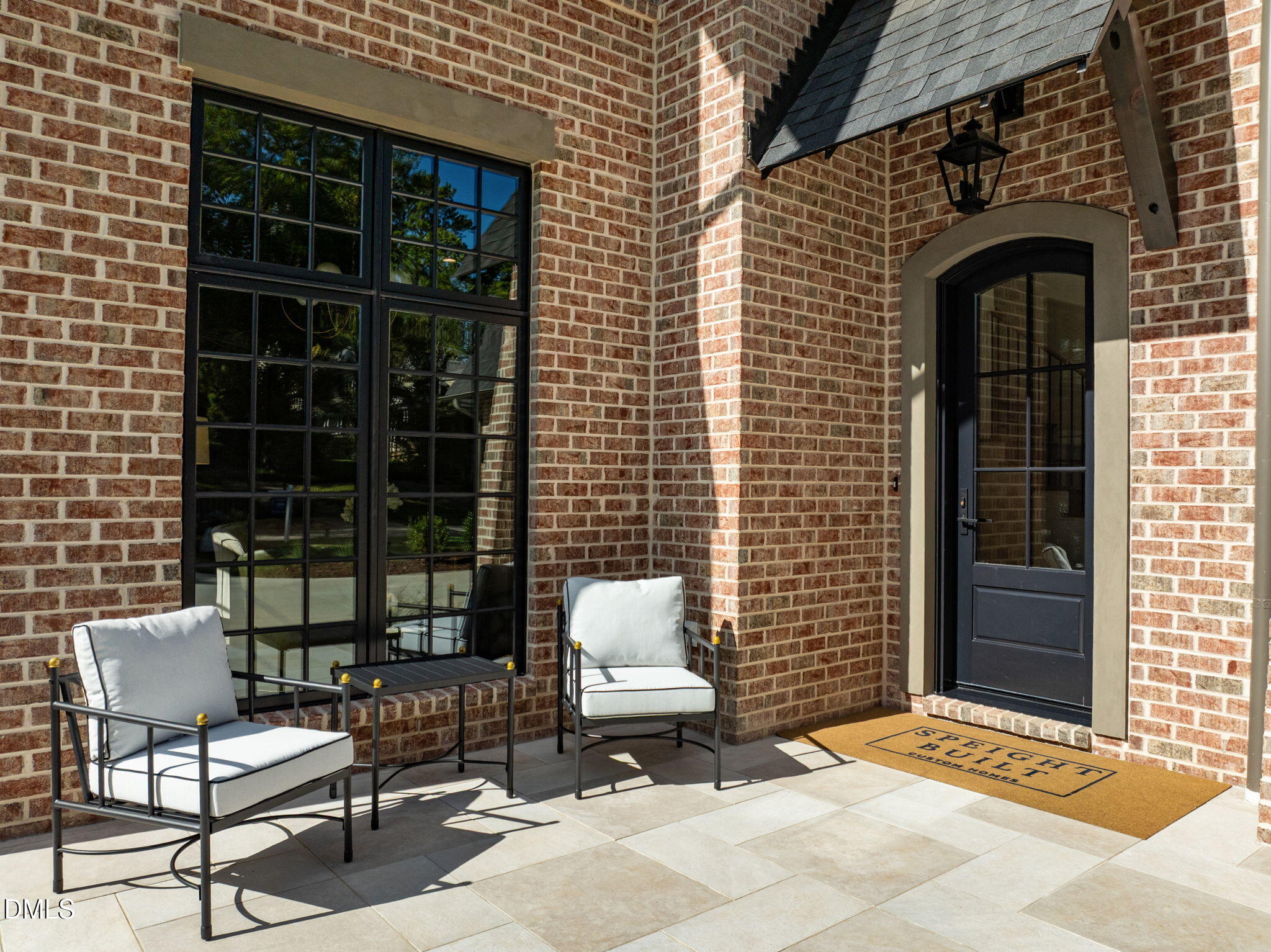 2733 Rothgeb Drive Raleigh, NC 27609 - Photo 4 of 63 a front view of a house with a couple of chairs