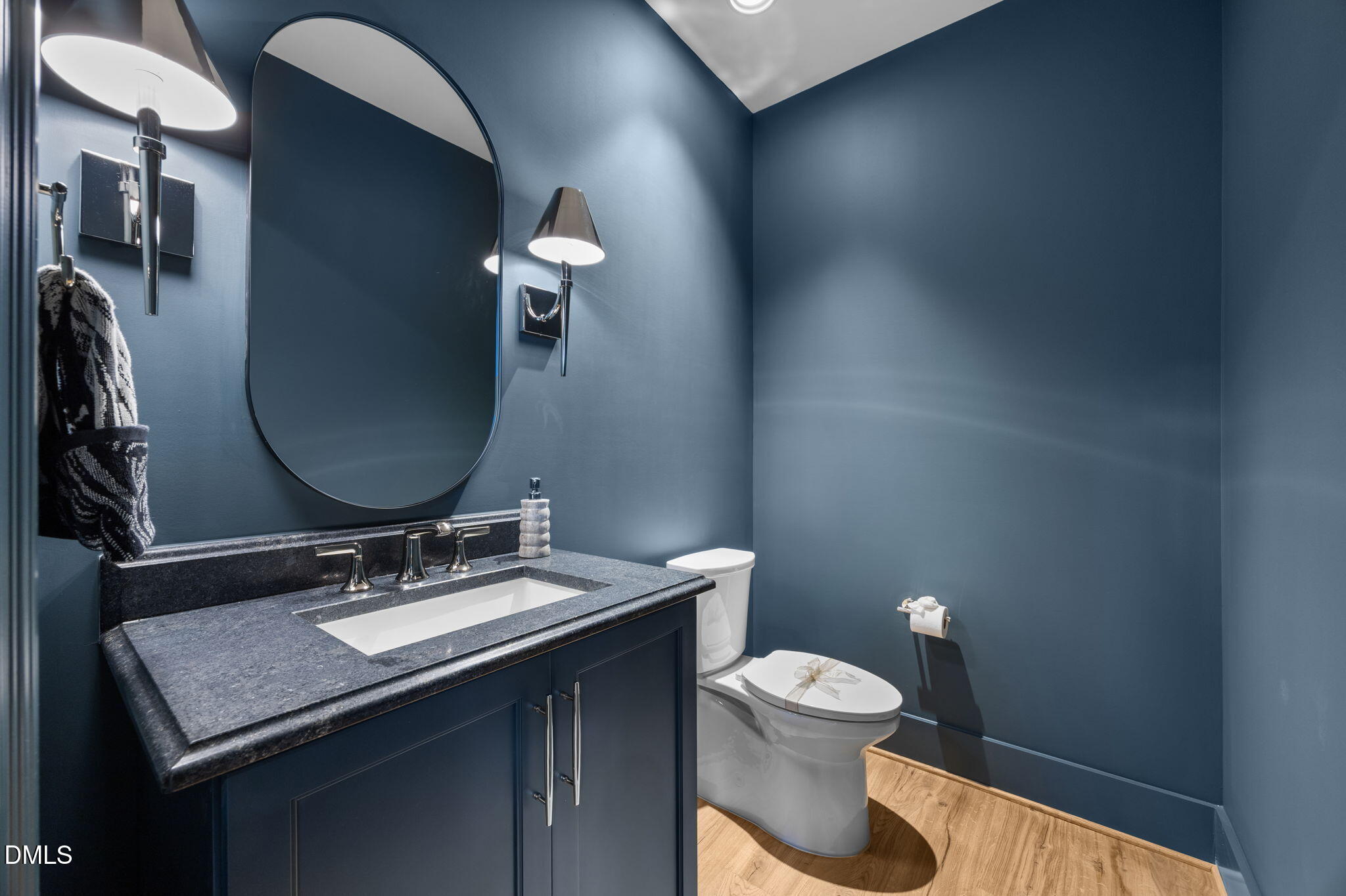 2733 Rothgeb Drive Raleigh, NC 27609 - Photo 42 of 63 a bathroom with a toilet a sink and mirror