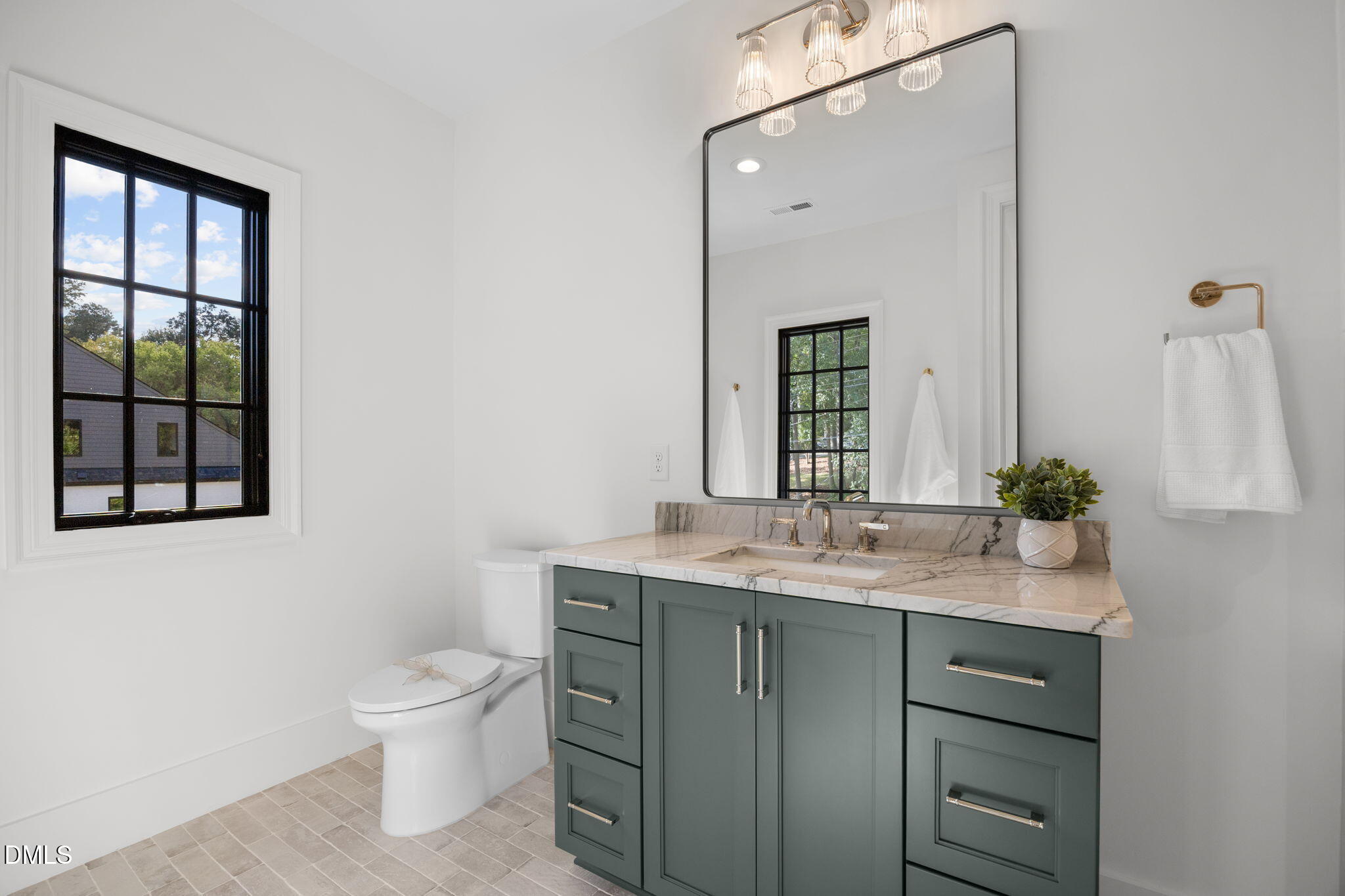2733 Rothgeb Drive Raleigh, NC 27609 - Photo 49 of 63 a bathroom with a granite countertop sink toilet and mirror