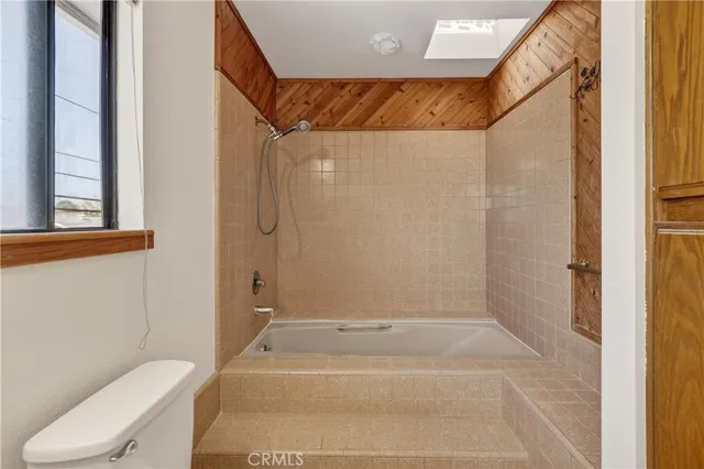 a bathroom with a shower and a toilet