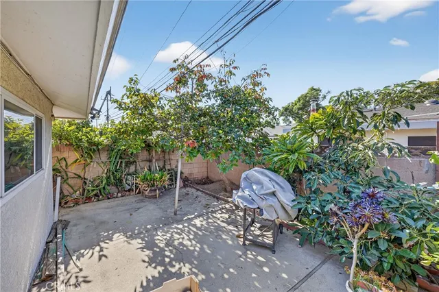 a couple of table and chairs in a yard