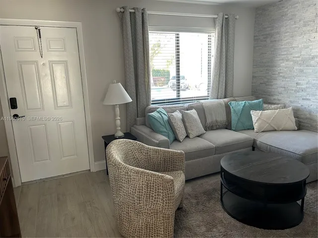 a terrace of a house with outdoor seating