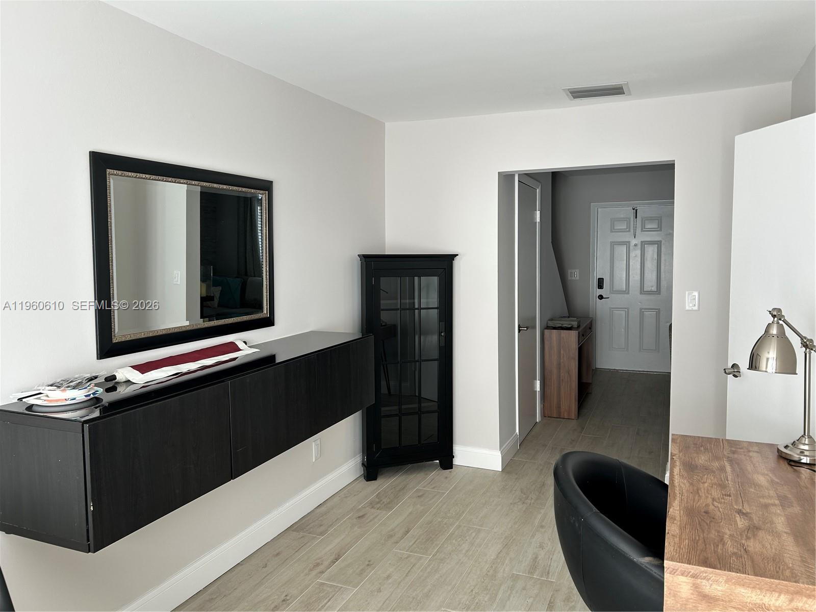 5555 Ludlam Road, Unit 501 South Miami, FL 33155 - Photo 9 of 20 a living room with furniture