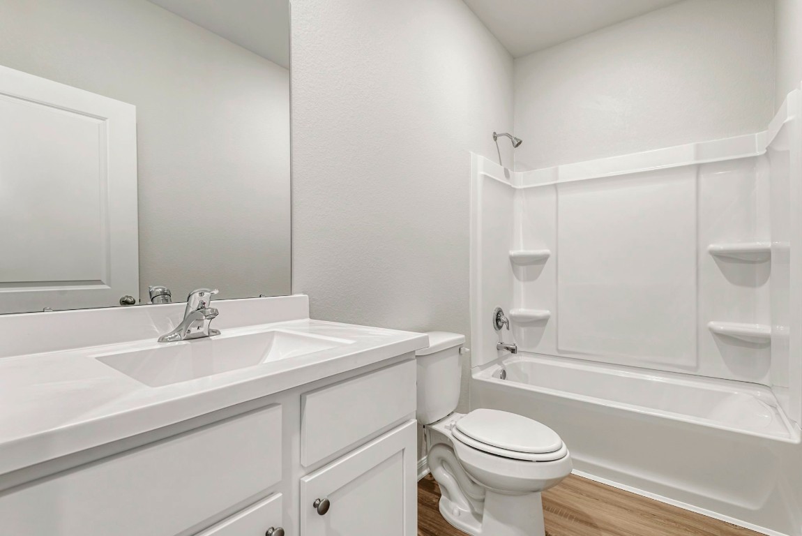 6414 Winter Elm Street Houston, TX 77048 - Photo 6 of 7 a bathroom with a sink toilet and shower