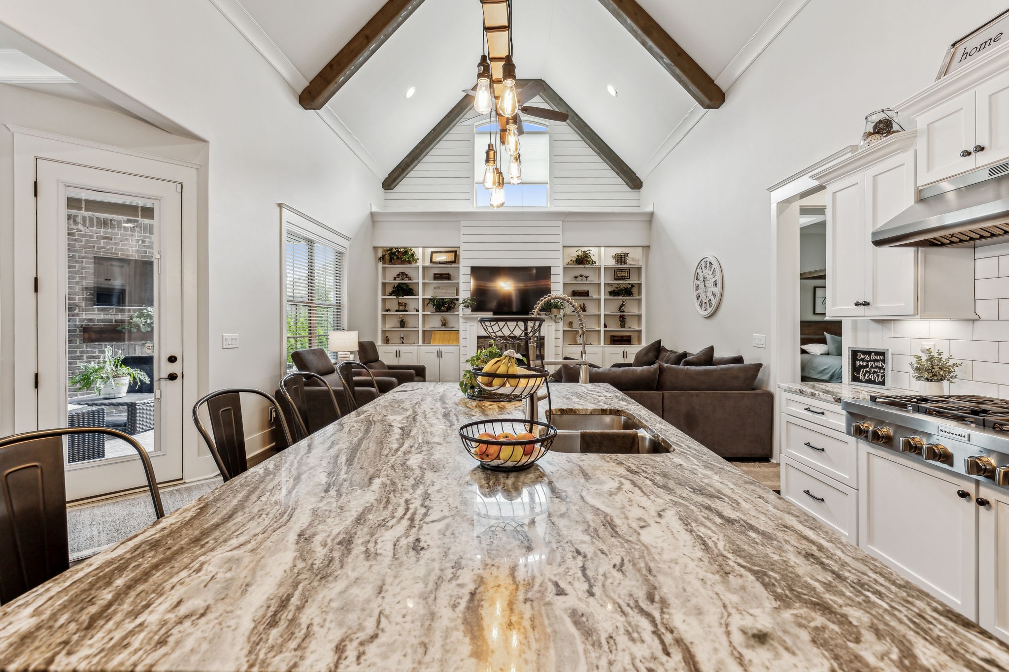 2054 Autumn Ridge Way Spring Hill, TN 37174 - Photo 17 of 50 a kitchen with sink a refrigerator and chairs