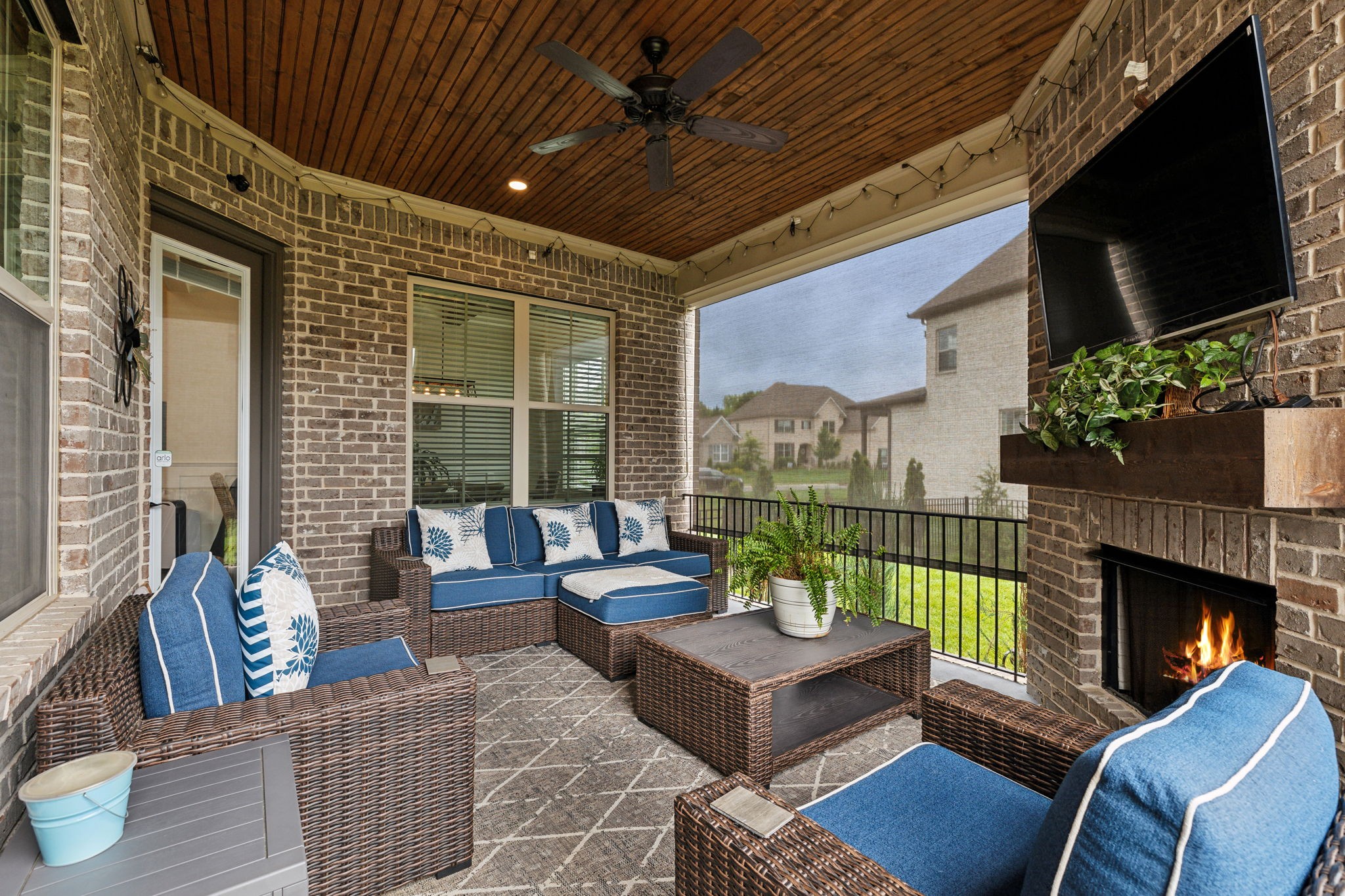 2054 Autumn Ridge Way Spring Hill, TN 37174 - Photo 22 of 50 a outdoor living space with furniture potted plant and a fireplace