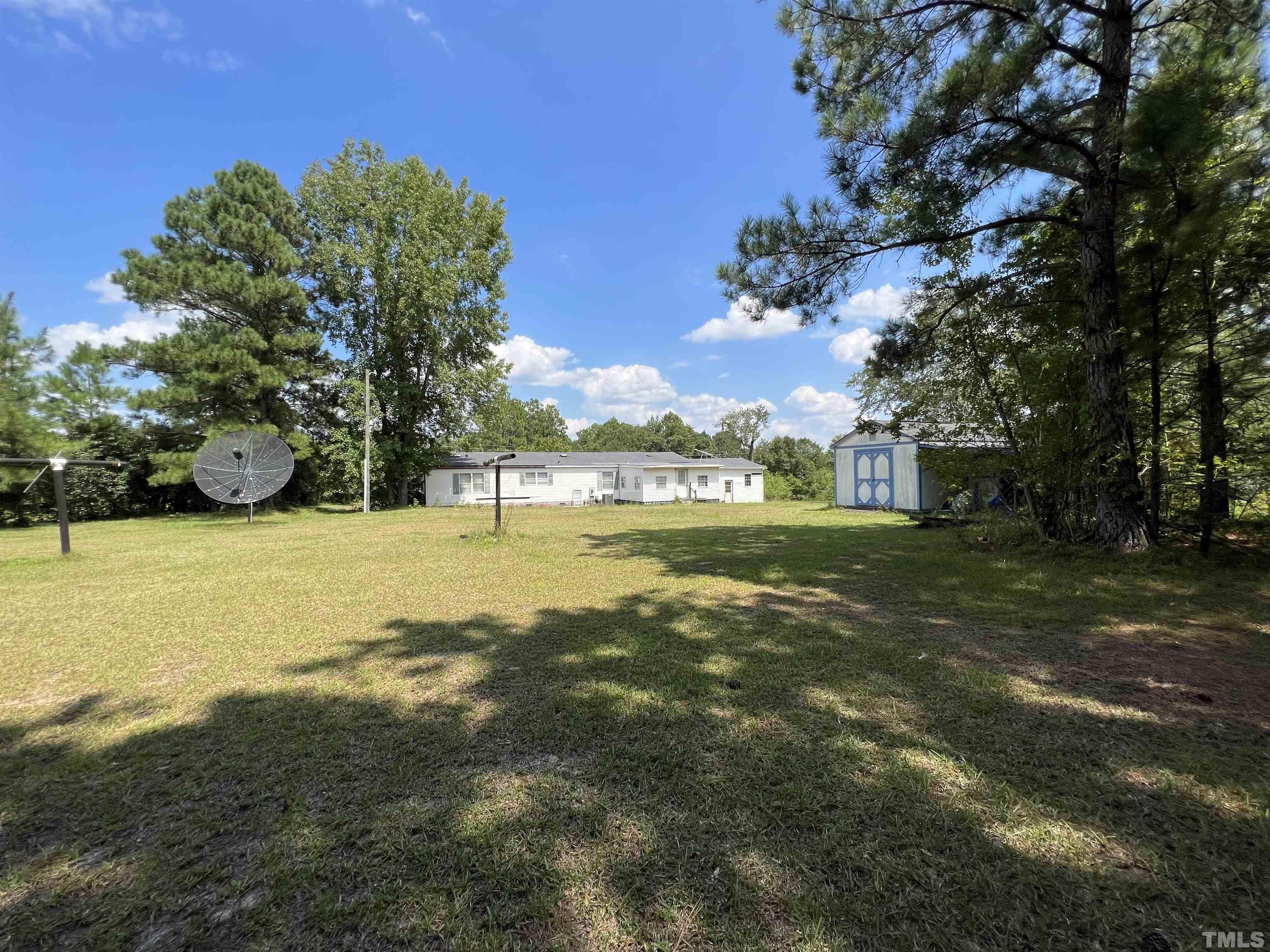 772 Nutgrass Road Bunnlevel, NC 28323 - Photo 3 of 6 a view of yard with swimming pool and green space