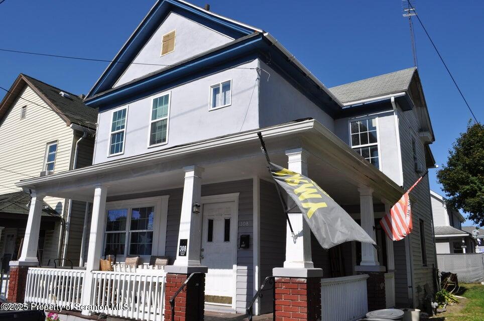 a front view of a house with balcony