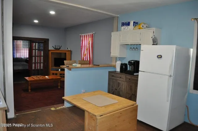 a utility room with closet dryer and washer