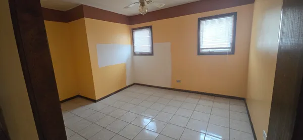 a kitchen with a stove top oven and cabinets
