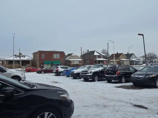 a view of a car parked in front of a building