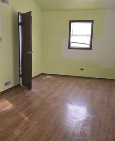 a bathroom with a sink a toilet and a window