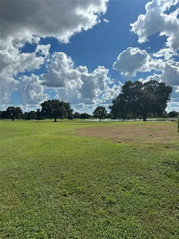 a view of a golf course with lots of green space