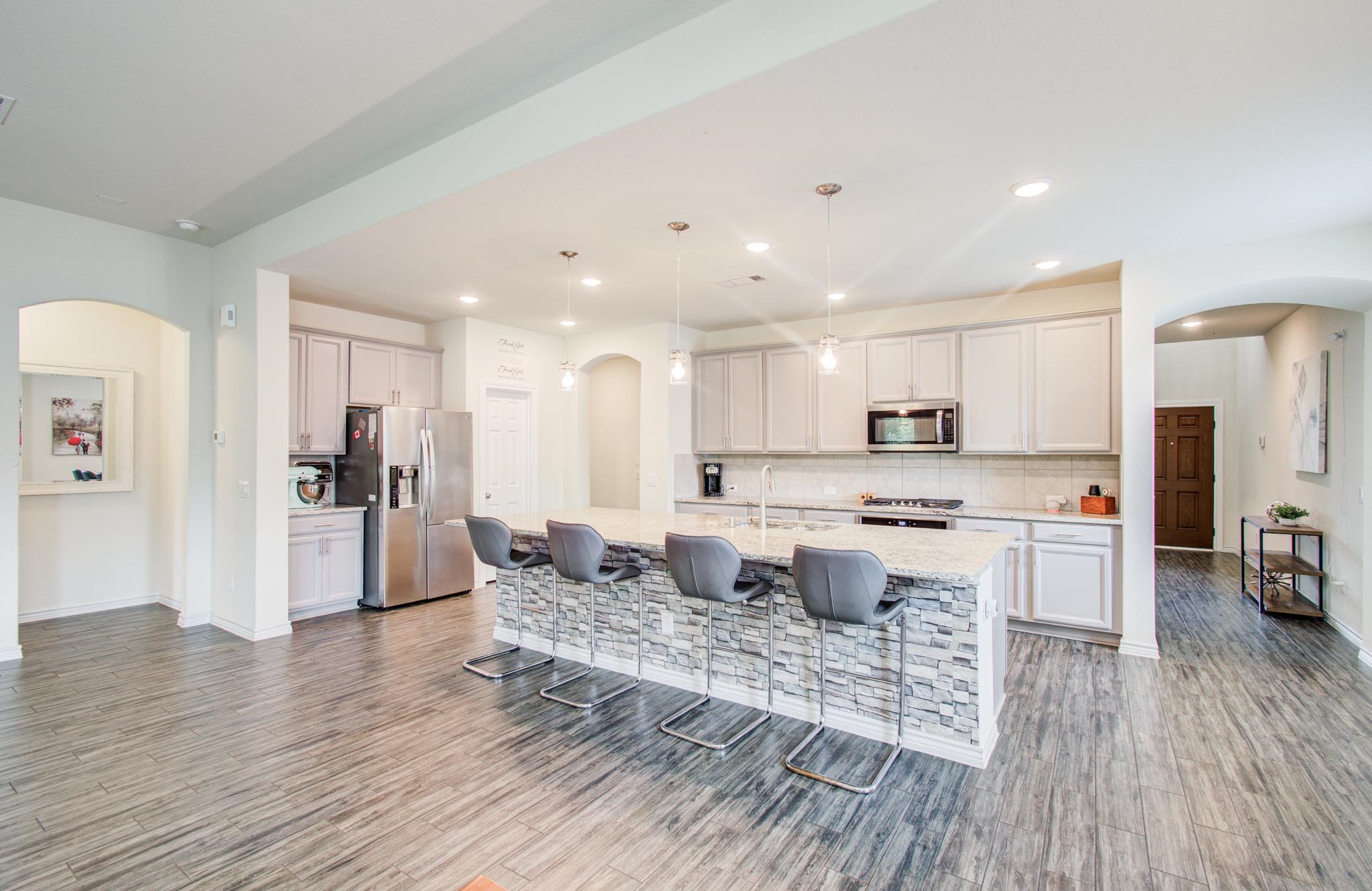 27817 Ellie Oak Lane Spring, TX 77386 - Photo 14 of 49 a large kitchen with cabinets