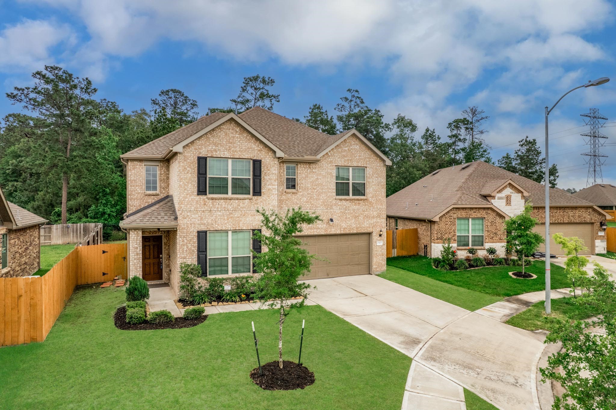 27817 Ellie Oak Lane Spring, TX 77386 - Photo 2 of 49 a front view of a house with a yard and garage