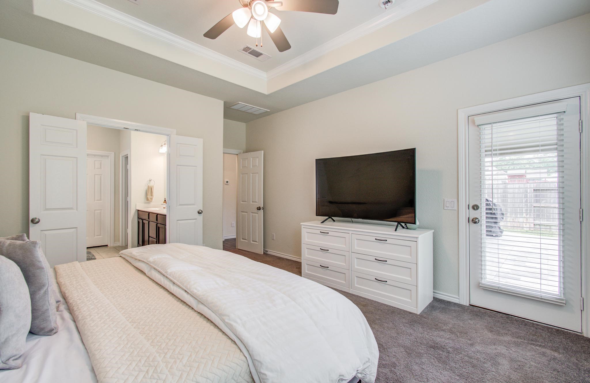 27817 Ellie Oak Lane Spring, TX 77386 - Photo 23 of 49 a bedroom with a bed and a flat screen tv