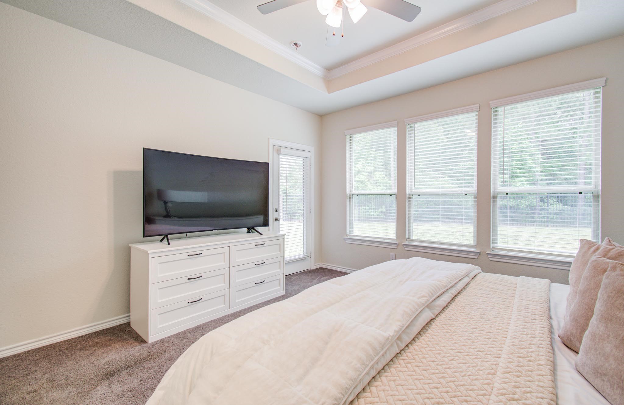 27817 Ellie Oak Lane Spring, TX 77386 - Photo 24 of 49 a bedroom with a flat screen television and a bed