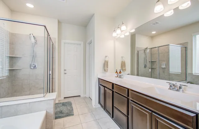a bathroom with a tub and a shower