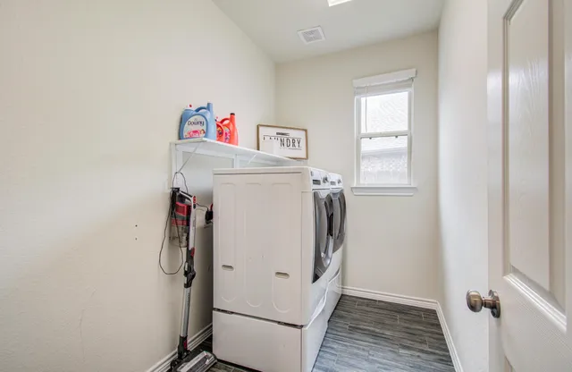 a living room with furniture and white walls