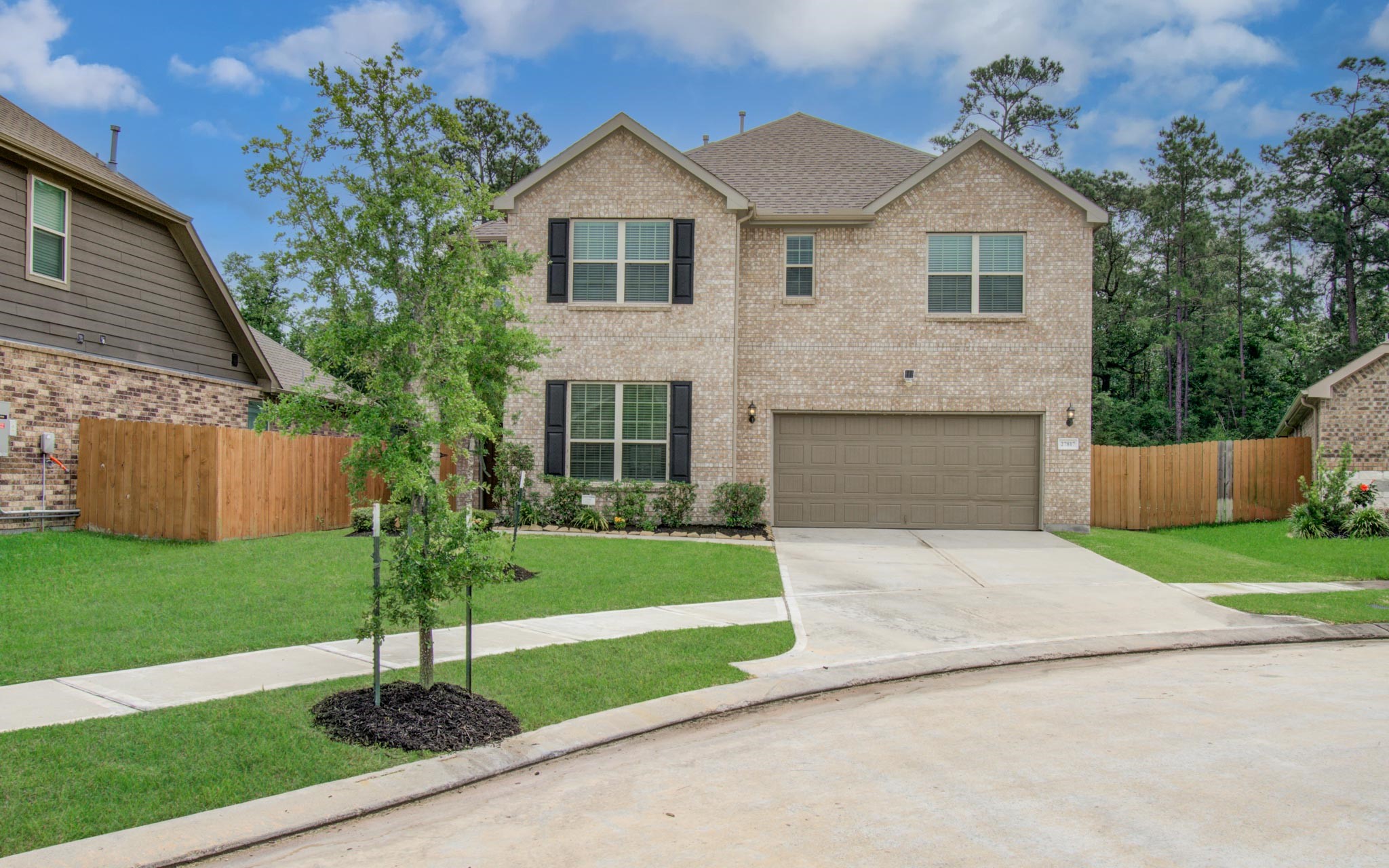 27817 Ellie Oak Lane Spring, TX 77386 - Photo 3 of 49 a front view of a house with a yard and garage