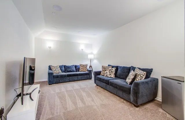 a living room with furniture and a couch