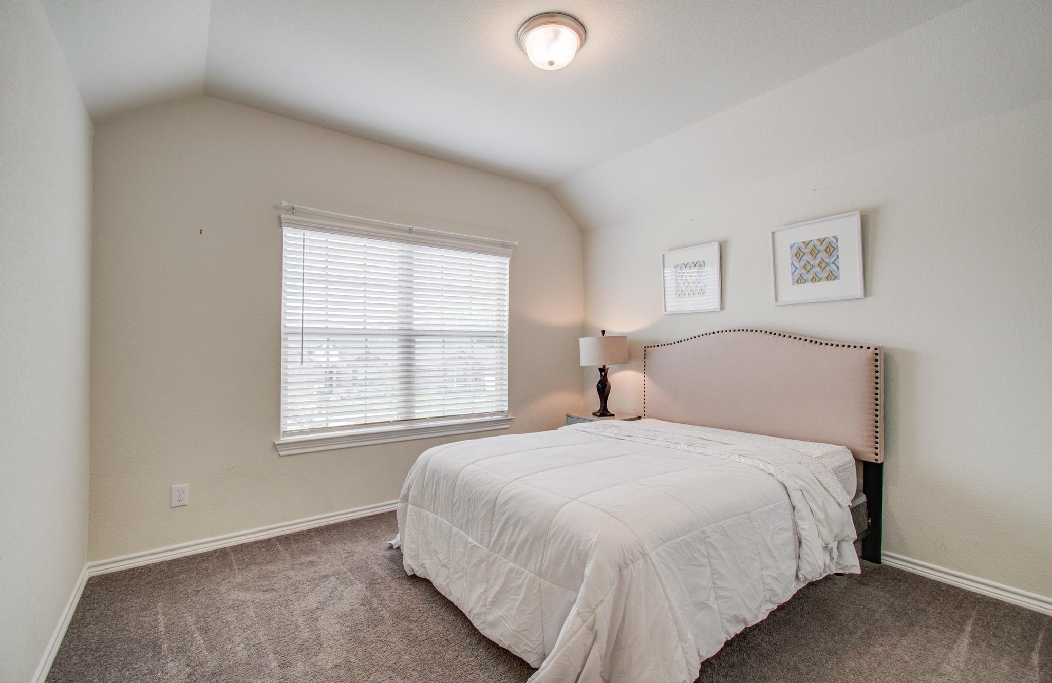 27817 Ellie Oak Lane Spring, TX 77386 - Photo 34 of 49 a bedroom with a bed and a window