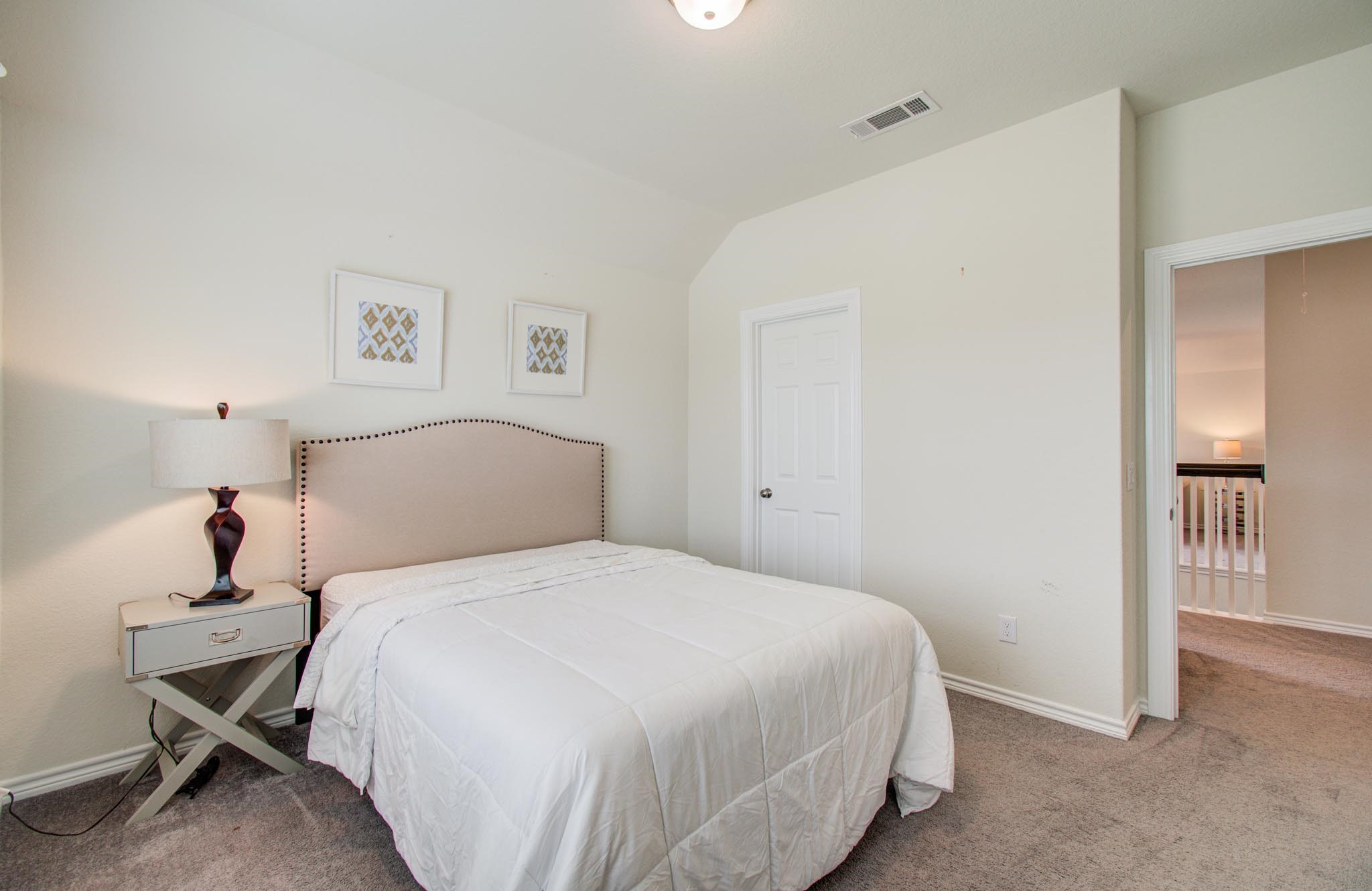 27817 Ellie Oak Lane Spring, TX 77386 - Photo 35 of 49 a bedroom with a bed and a chair